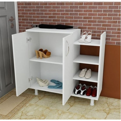 A white entryway shoe cabinet with two doors open, showing shelves and open side compartments filled with shoes. The cabinet stands on a tiled floor against a brick wall and door background.