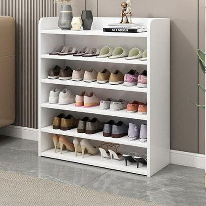 White shoe rack with various shoes on shelves in a room setting.