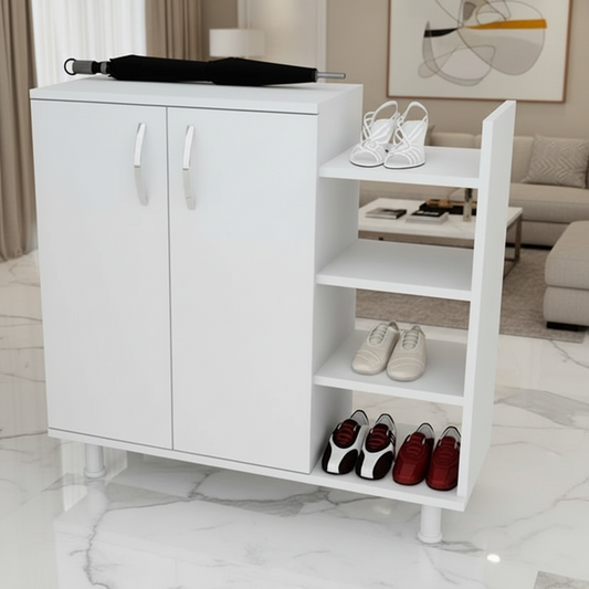 A white two-door shoe cabinet with open side shelves, shown in a bright living room. The cabinet has two silver handles and is styled with shoes on top and inside the shelves, with an umbrella resting on top.