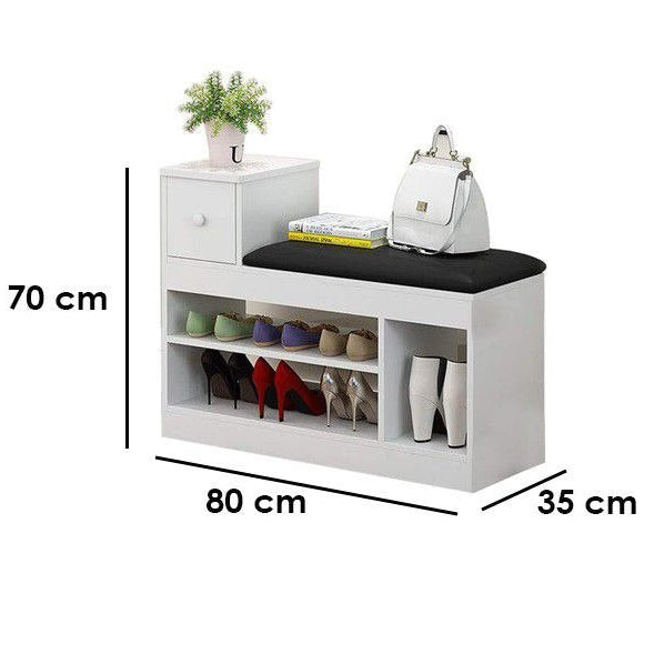 White entryway bench with shoe storage, black seat cushion, and decorative accessories, shown with dimension labels (70 cm, 80 cm, 35 cm) alongside a black human silhouette indicating 180 cm height on a white background.