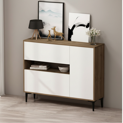 A modern sideboard cabinet with a white front and natural wood grain sides, shown in a styled room setting with decorative items on top.