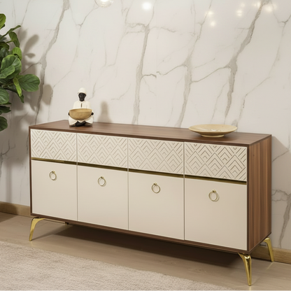 A modern sideboard or credenza with a dark wood top and frame, cream-colored lower cabinet doors, geometric patterned drawer fronts, and gold-tone legs and ring pulls, shown in a styled interior setting with two hexagonal mirrors and wall paneling.